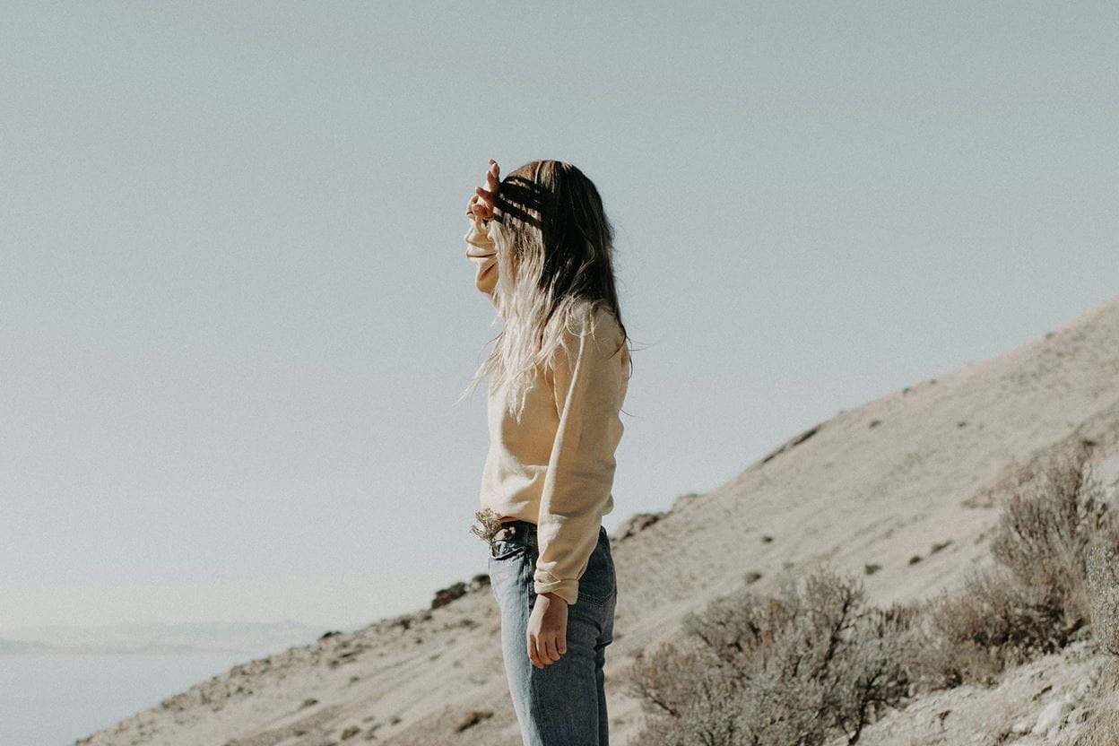 Image of a woman staring into the distance.