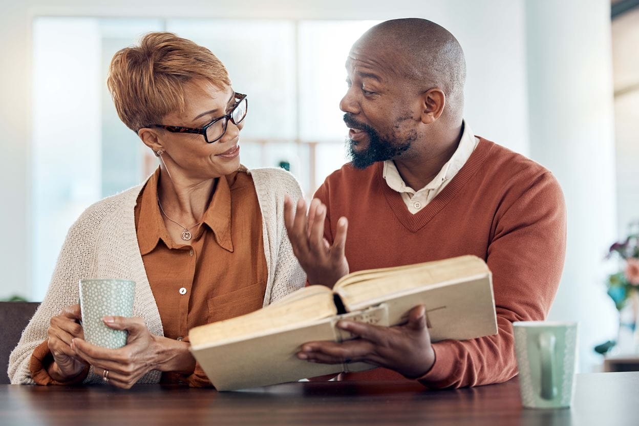 Man and Women looking at the bible?