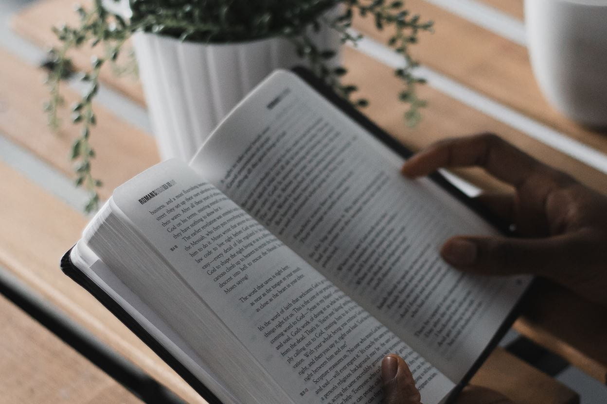 An open Bible being read for a daily devotional.